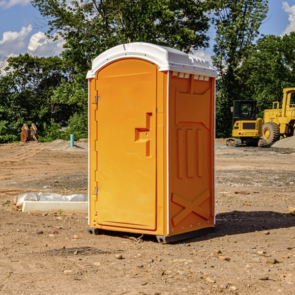 what is the cost difference between standard and deluxe portable restroom rentals in Russell County KS